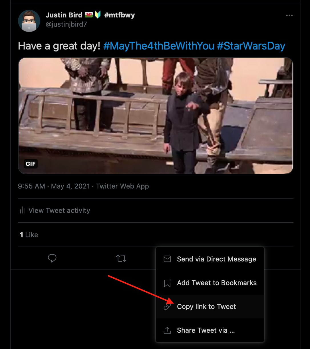 picture of a tweet pointing at the share icon