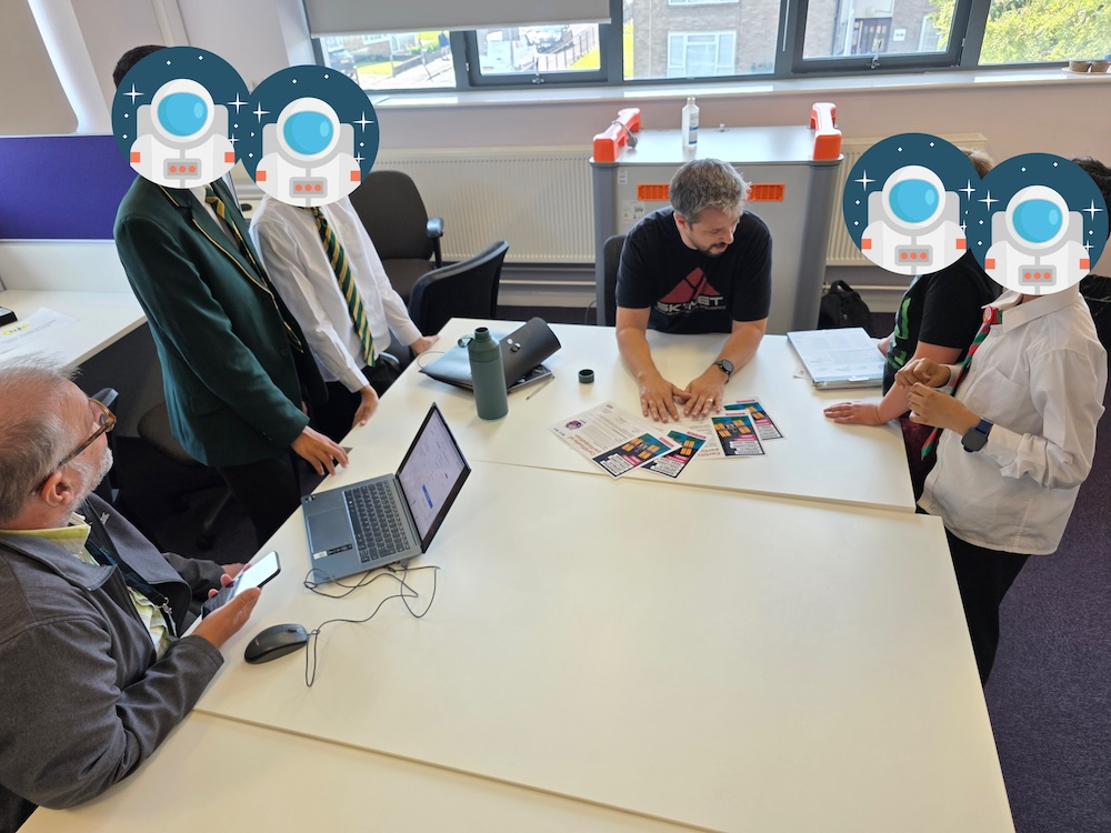 A picture of me presenting 4 of the children in my CodeClub with their certificates.